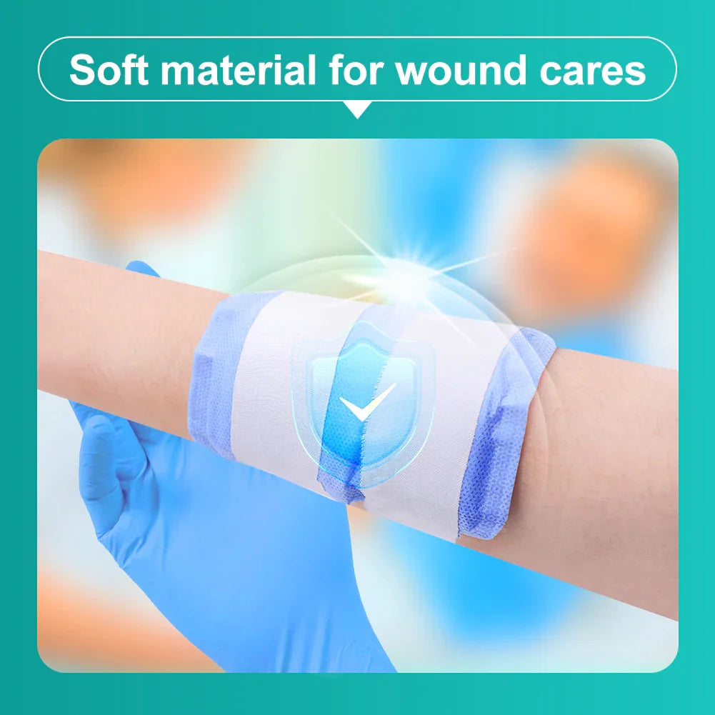 Soft wound care bandage applied on arm, held by hand in blue medical glove