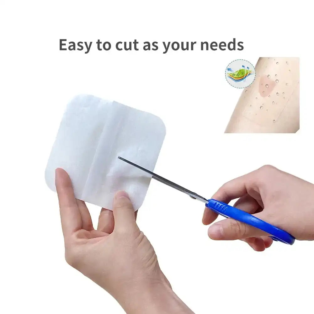 Hand cutting a square adhesive wound dressing with scissors, waterproof bandage for medical care